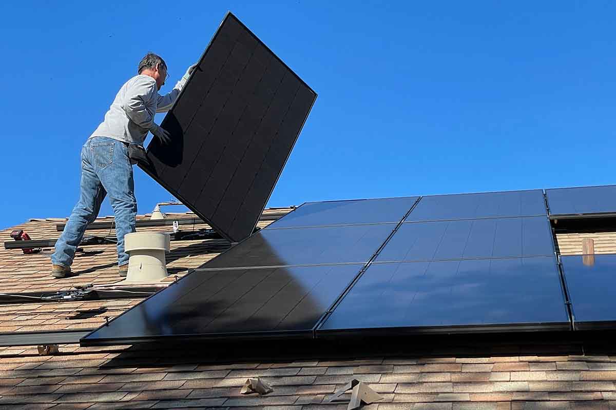 man installing solar pannel