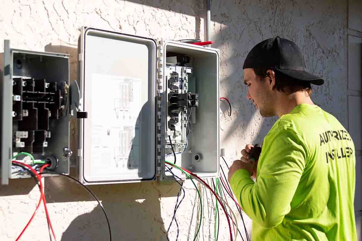 man installing solar pannel