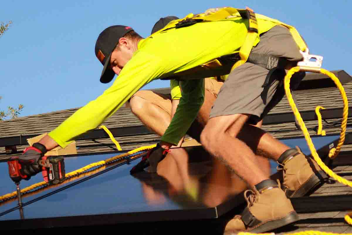 man installing solar pannel